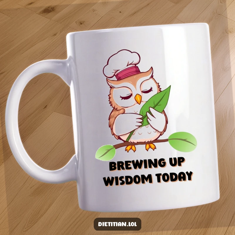 Funny mug with a wise owl wearing a chef hat, examining a vibrant leaf, perfect culinary gift.